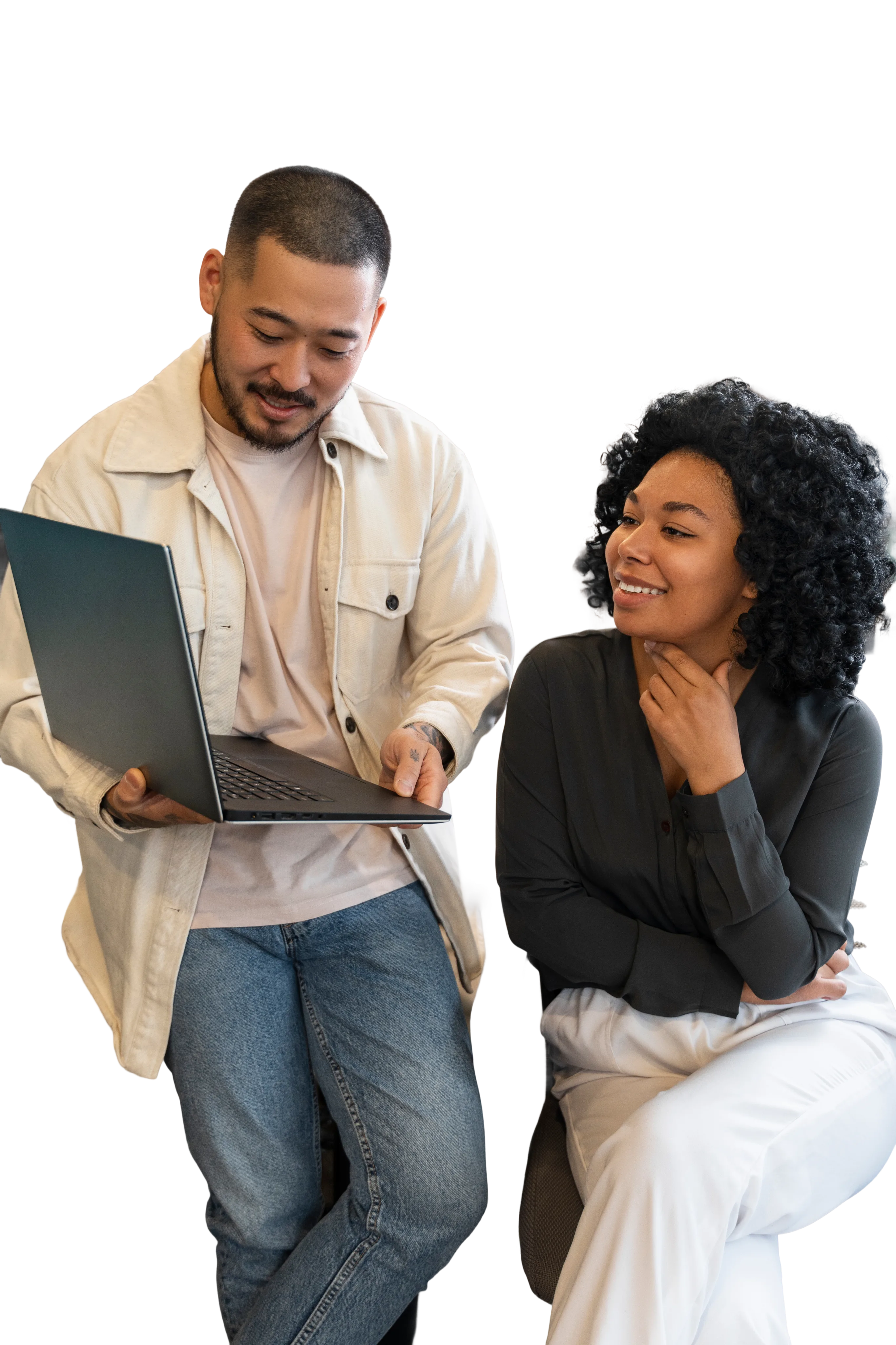 Two professionals reviewing SEO results on a laptop